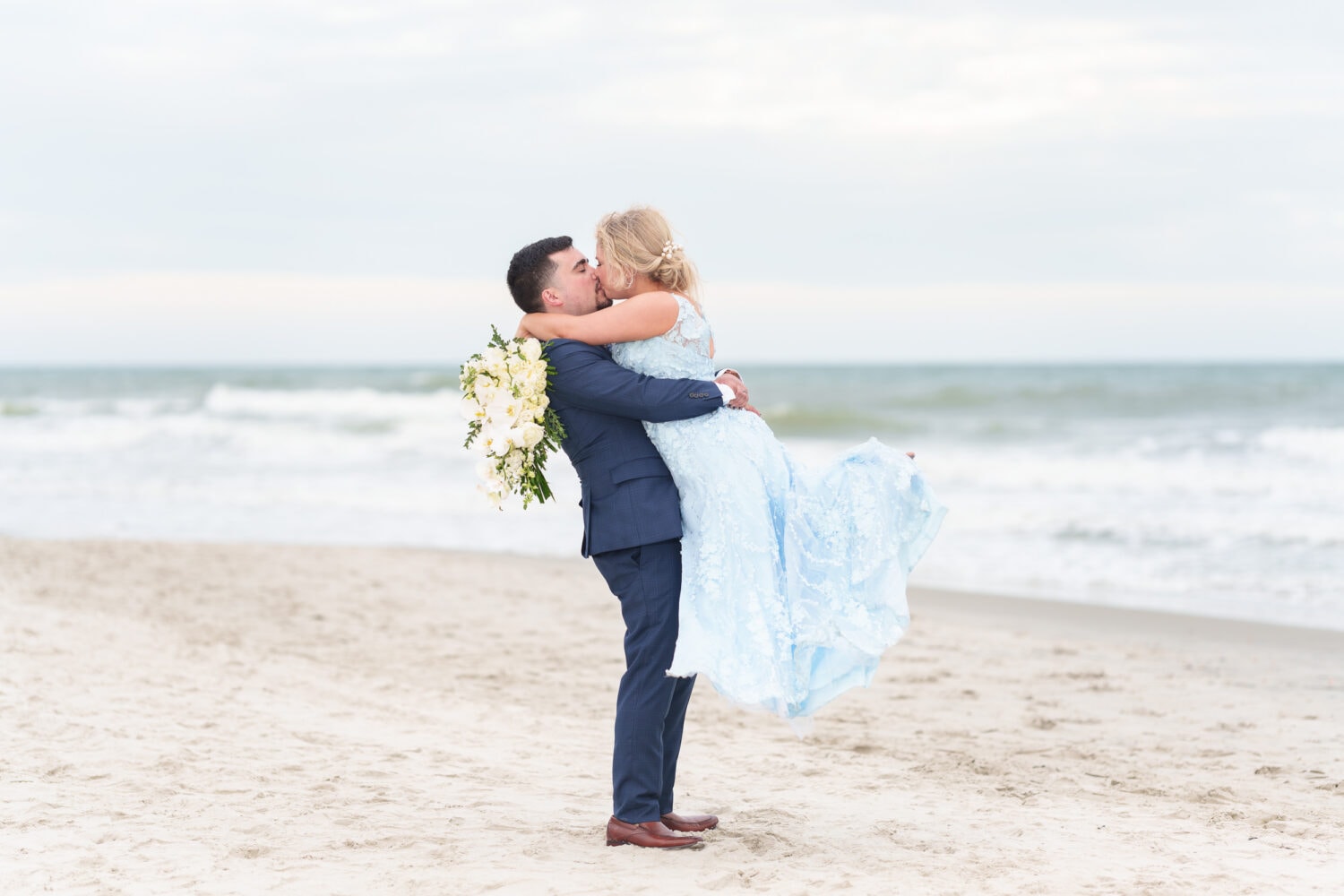 Lifting bride into the air for a kiss - Hilton Myrtle Beach Resort