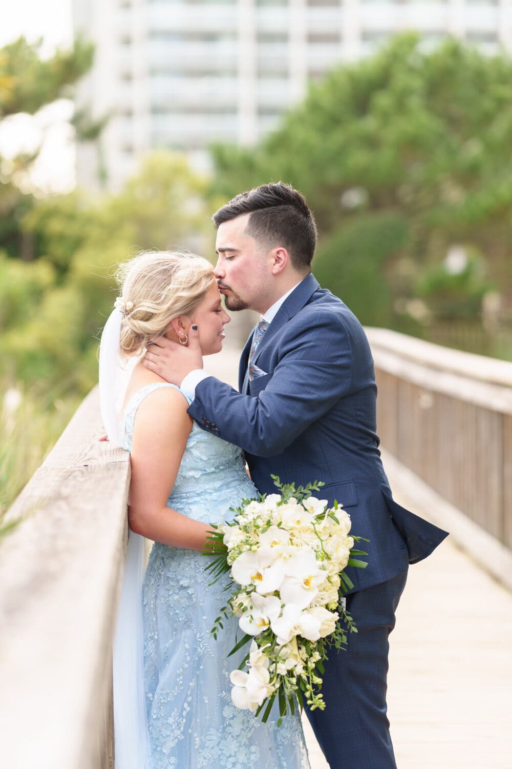 Romantic portraits with the bride and groom on a boardwalk after the first look - Hilton Myrtle Beach Resort