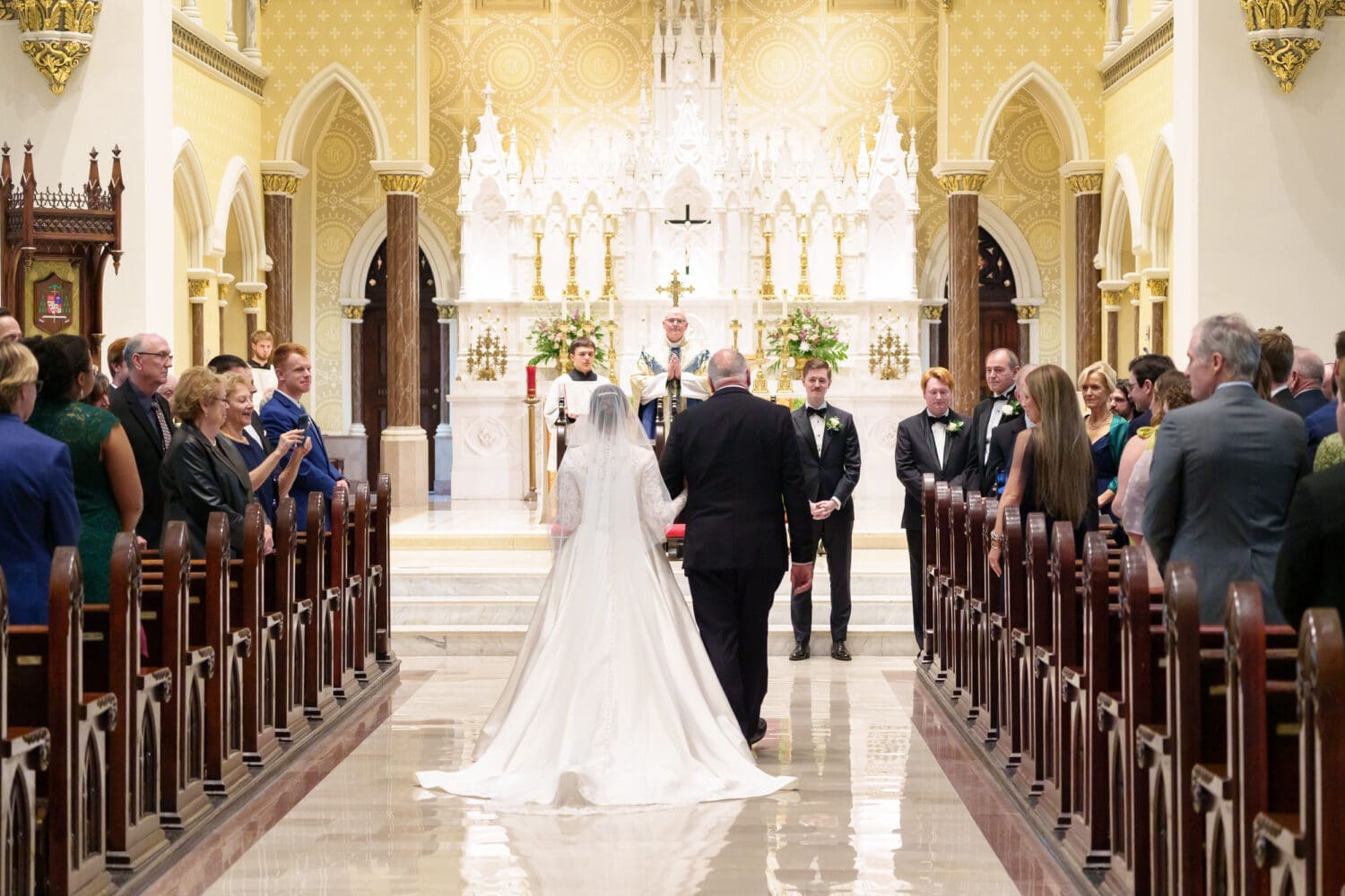 Bride and father walking down the aisle - Cathedral of Saint John Charleston