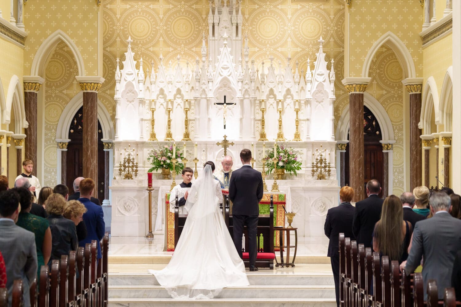 Bride and groom during the ceremony - Cathedral of Saint John Charleston
