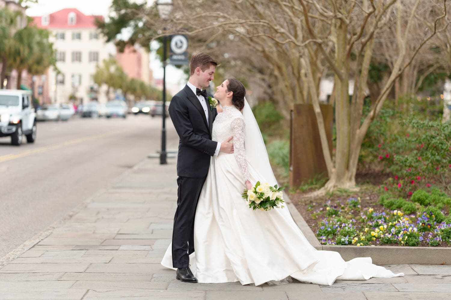 Bride and groom on the busy street - Marion Square Charleston