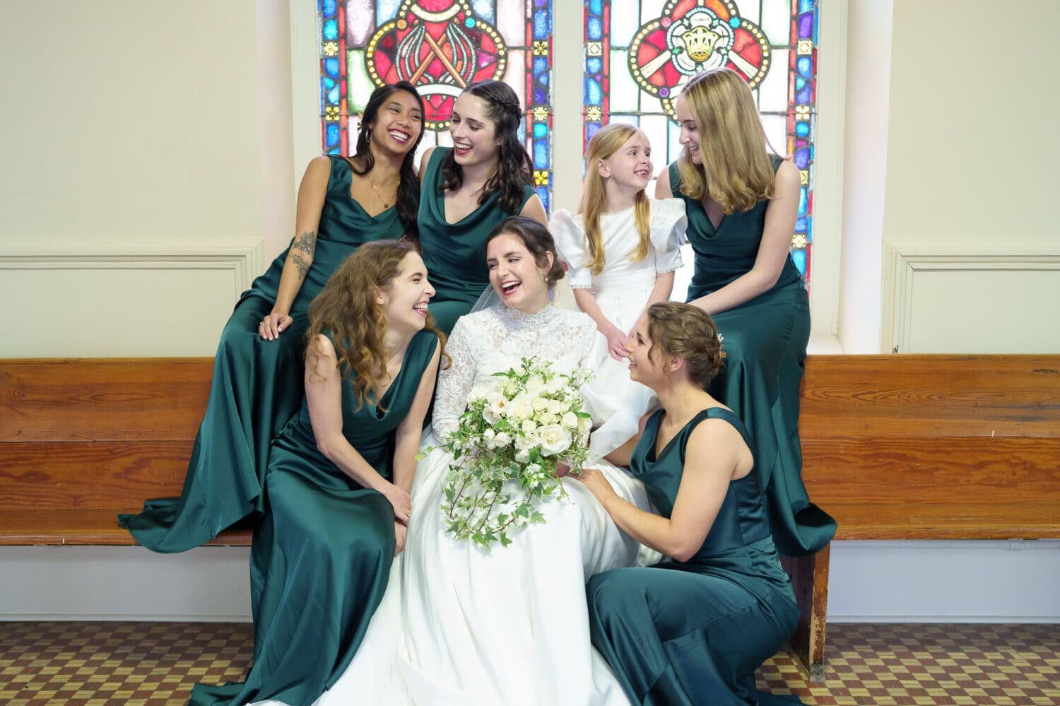Bride laughing with bridesmaids - Cathedral of Saint John Charleston