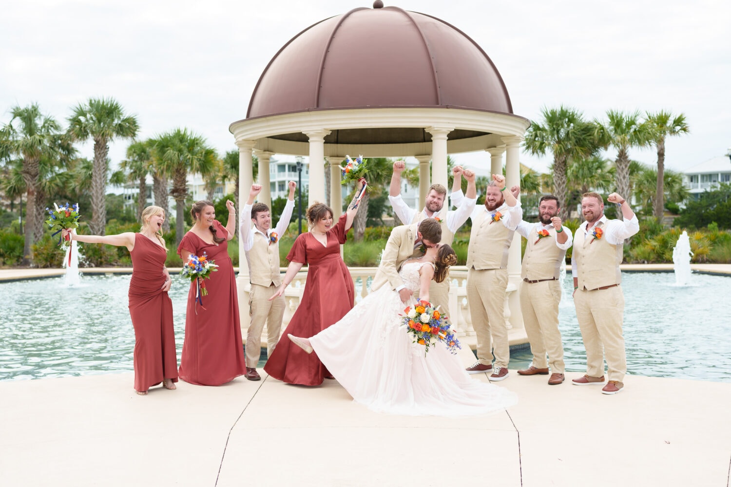 Dip back for a kiss with cheers from the wedding party - 21 Main Events - North Myrtle Beach