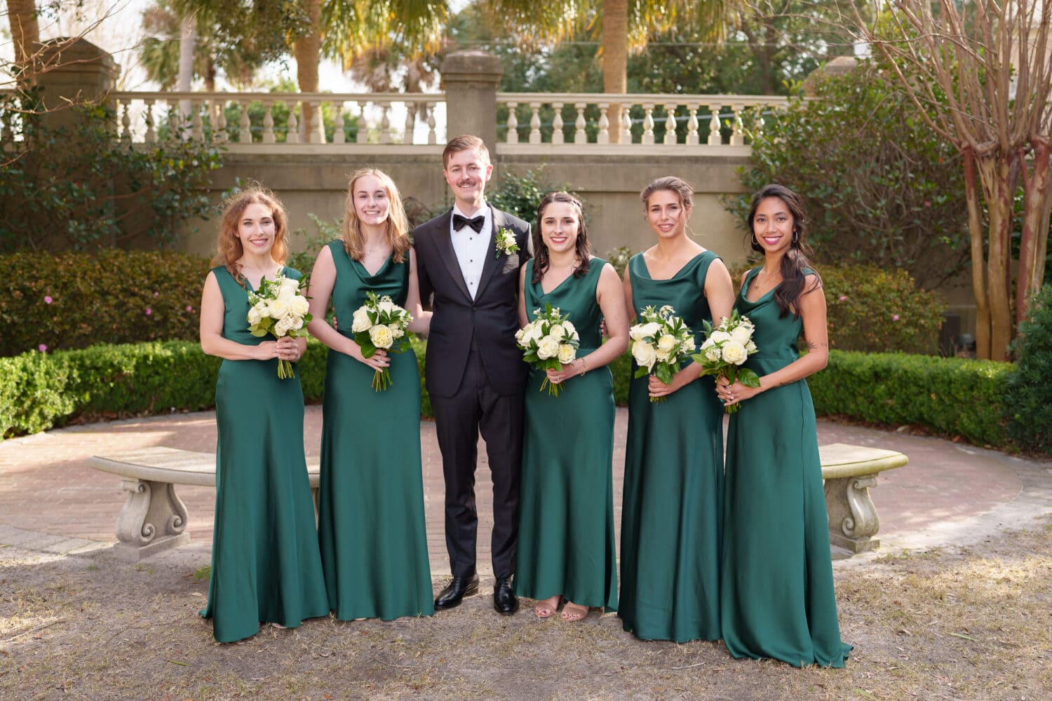 Groom with the bridesmaids - Cathedral of Saint John Charleston