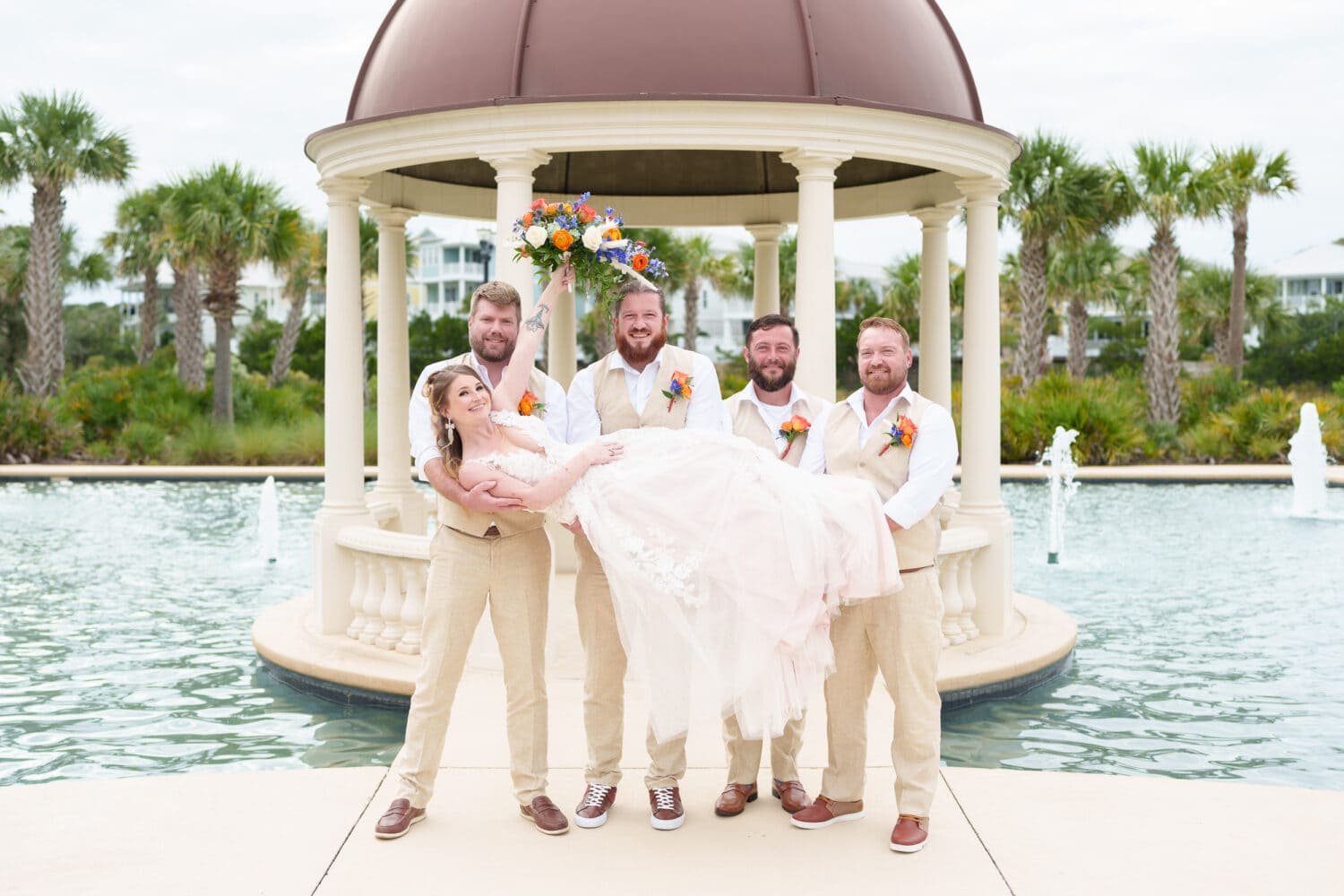 Groomsmen lifting up the bride - 21 Main Events - North Myrtle Beach