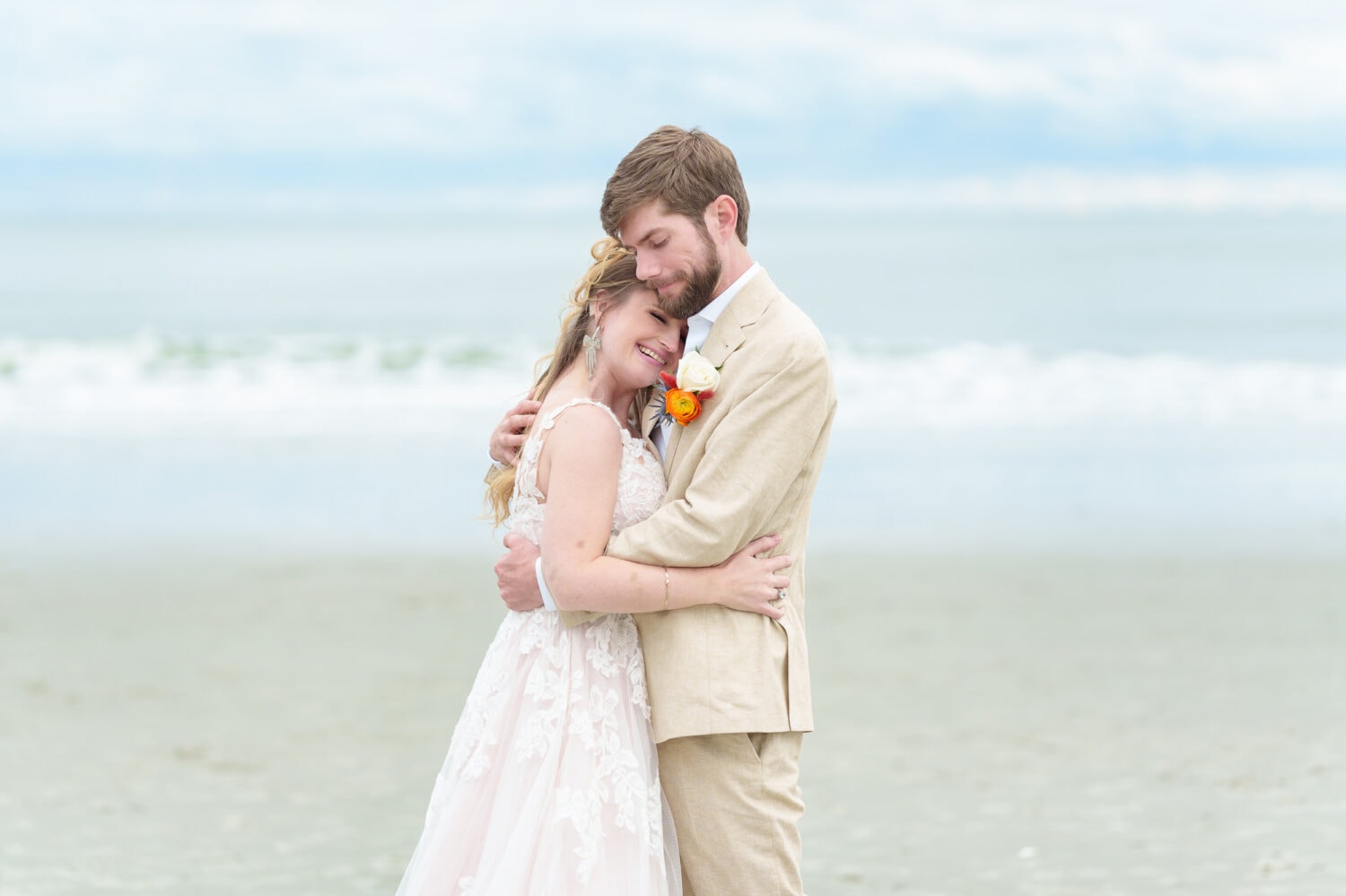 Hug on the beach with bride and groom - 21 Main Events - North Myrtle Beach