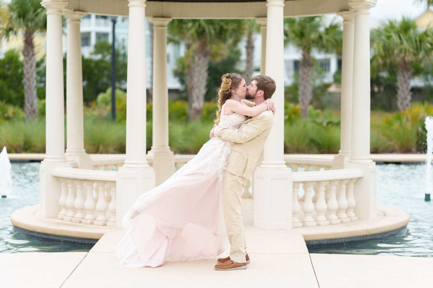 Lifting bride into the air for a kiss - 21 Main Events - North Myrtle Beach