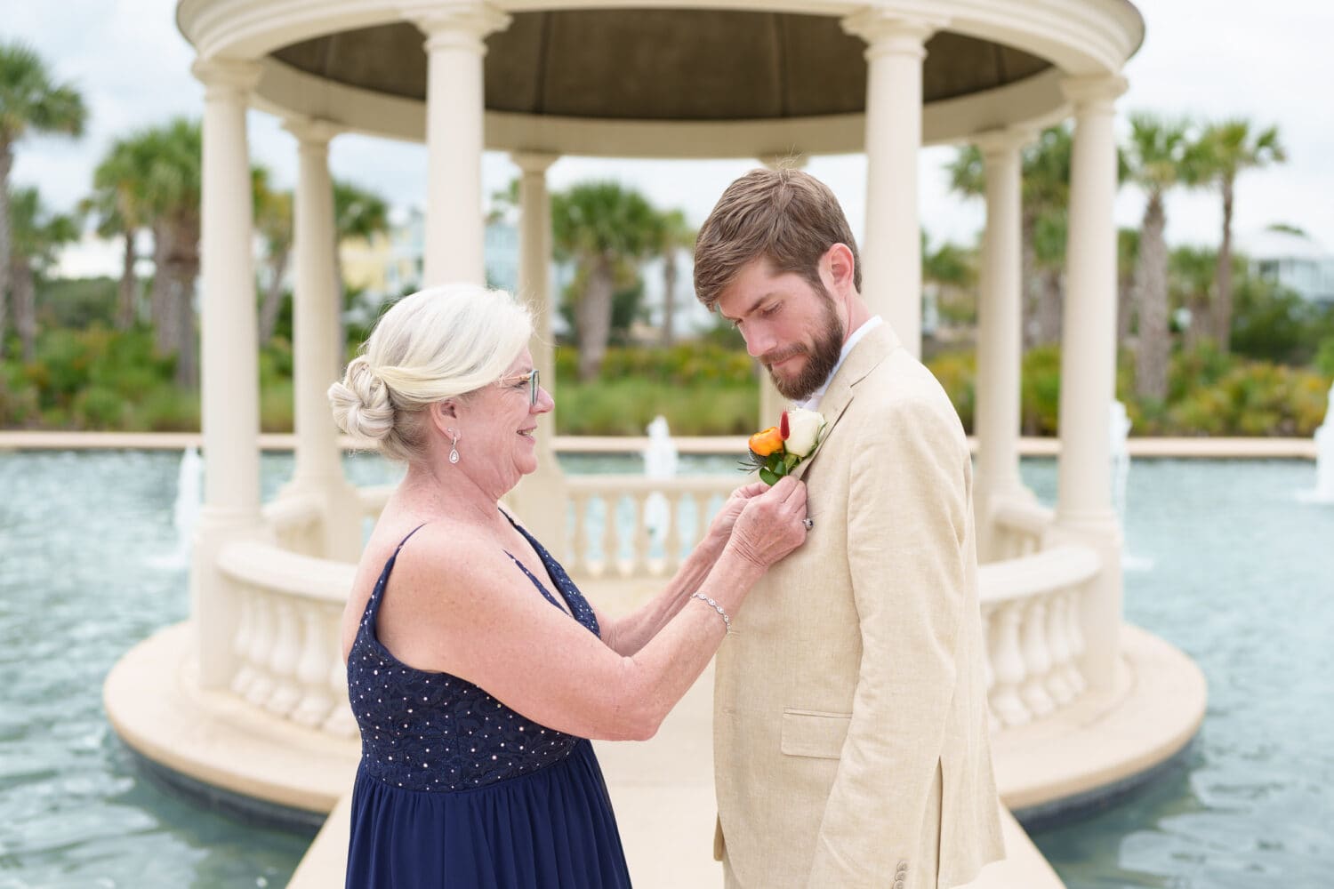 Mom helping son with his boutonniere - 21 Main Events - North Myrtle Beach