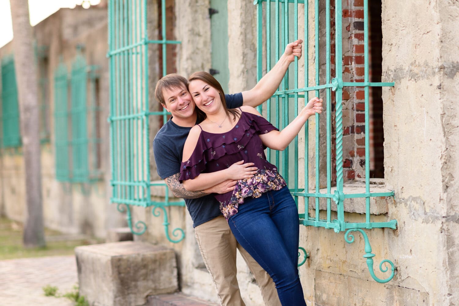 Couple having fun behind the Atalaya Castle -