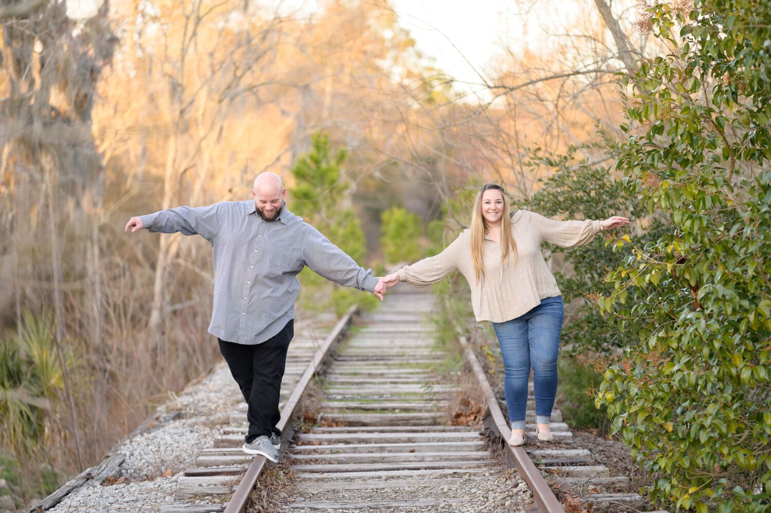 Couple on the old train tracks - Conway Riverwalk