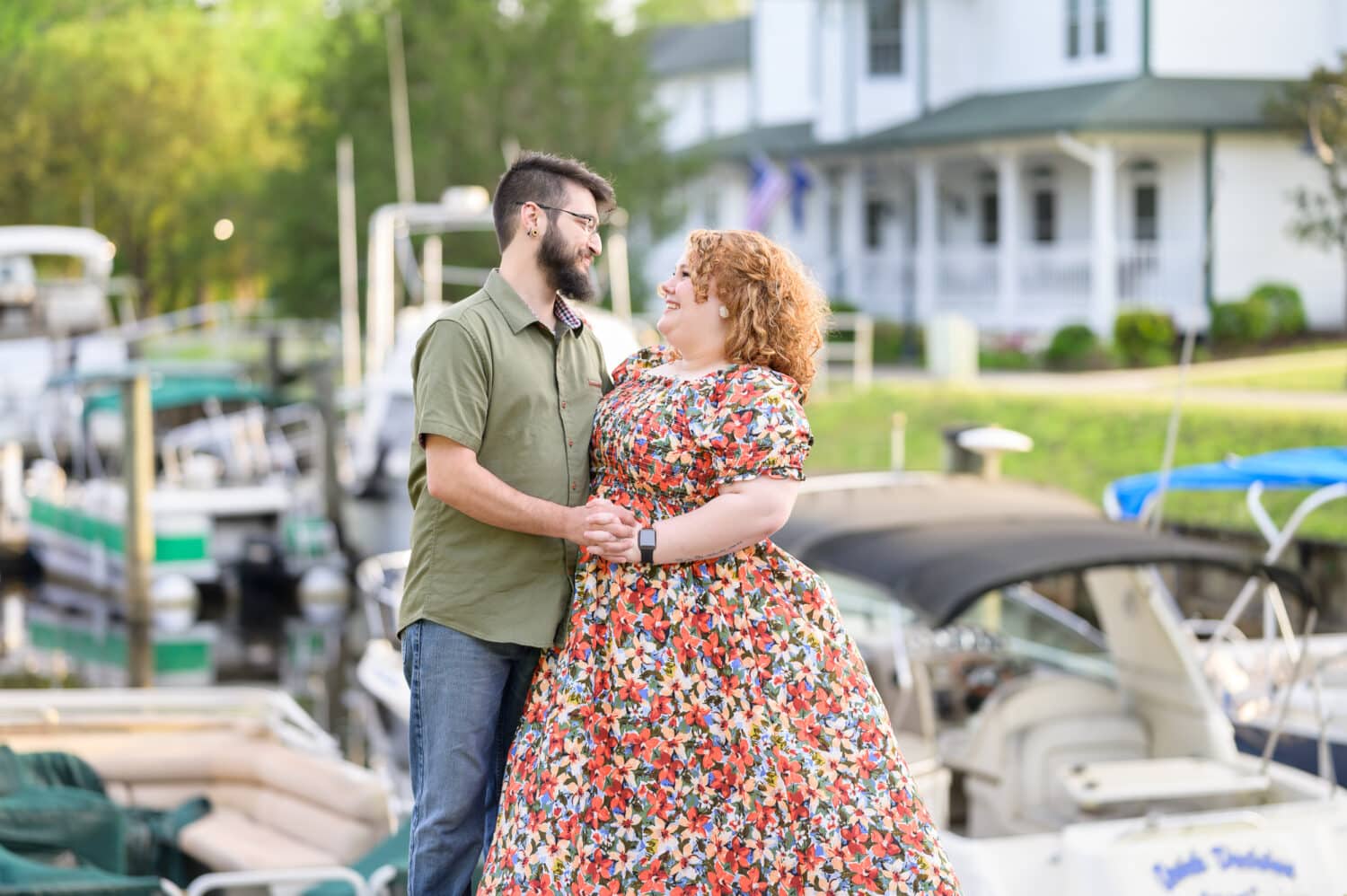Engagement pictures by the boats - Conway Riverwalk