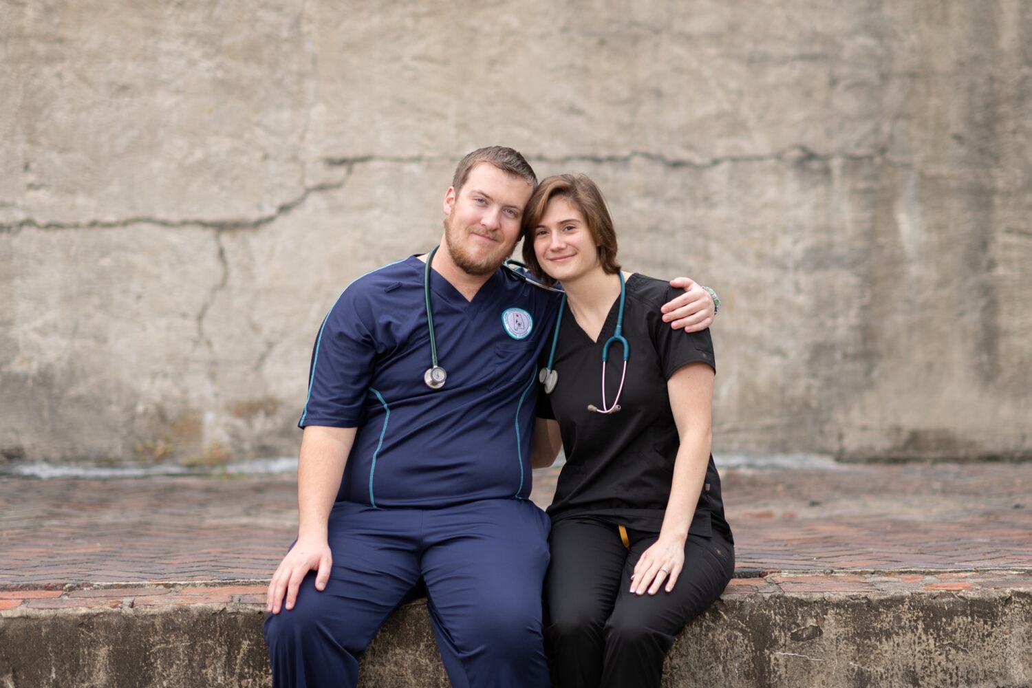 Engagement pictures in their nurse uniforms - Huntington Beach State Park