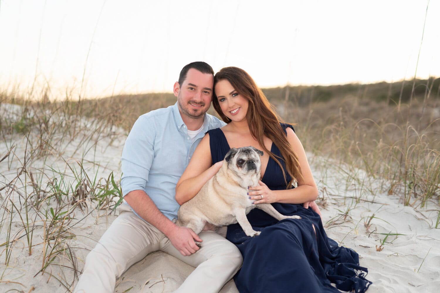 Engagement portrait by the dunes with their dog - Huntington Beach State Park