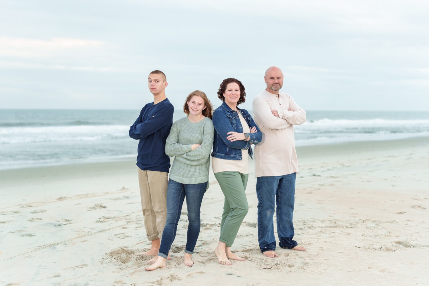 Family giving me their best fun pose on the beach -