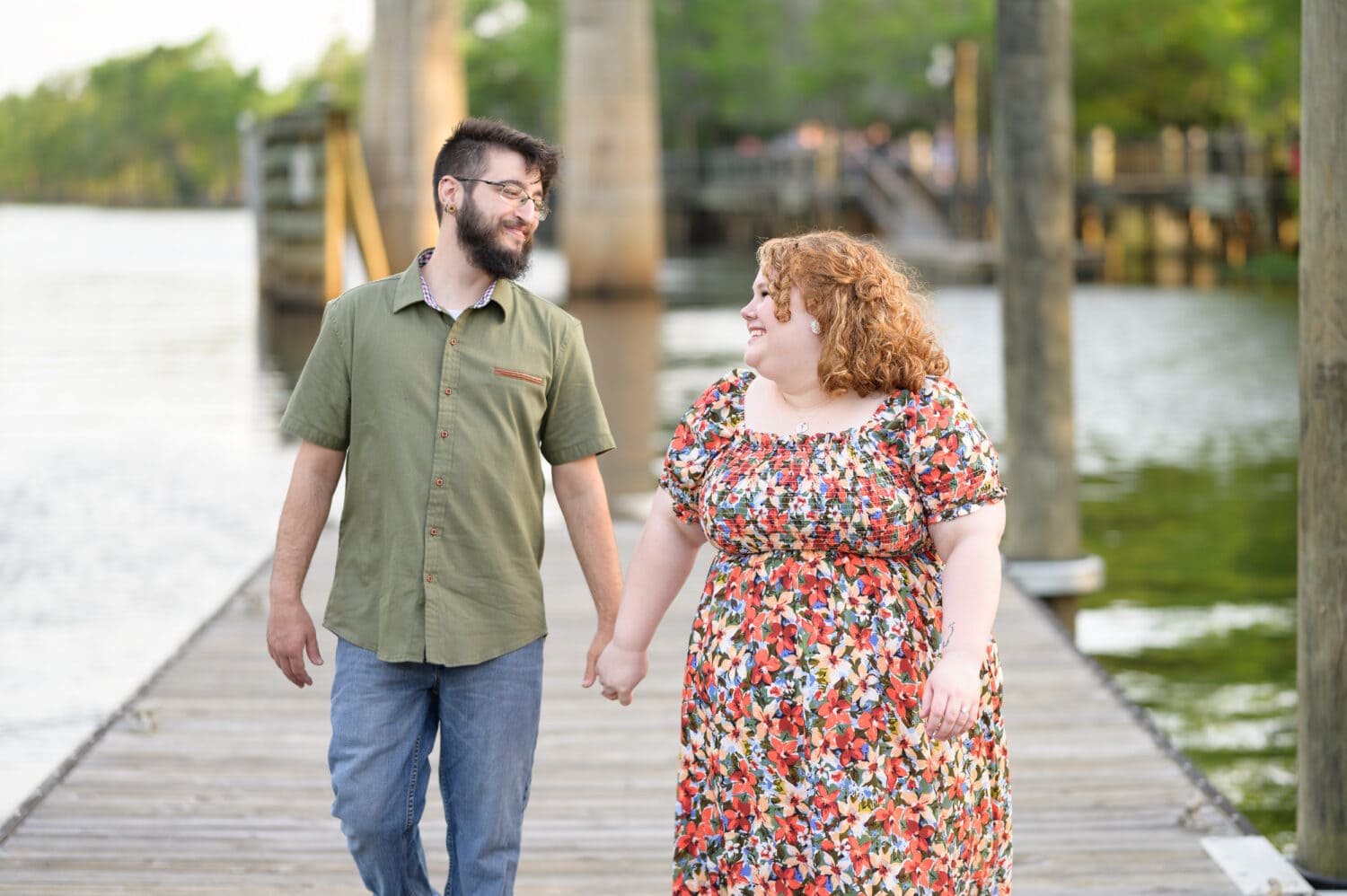 Happy couple walking by the water - Conway Riverwalk