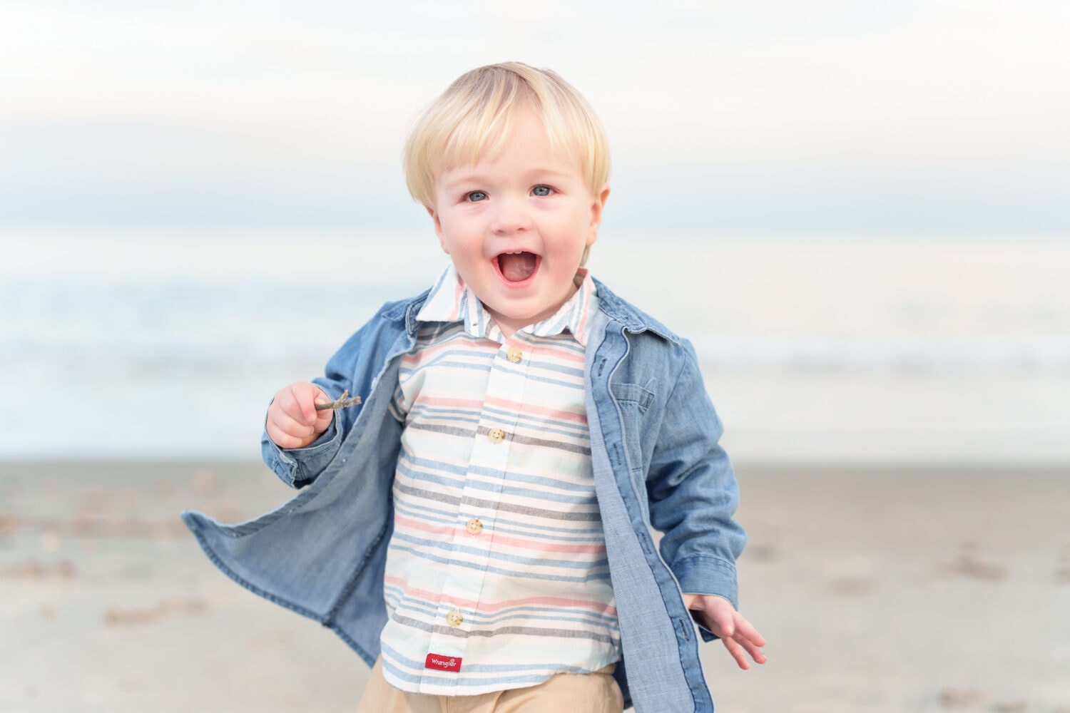 Happy little boy running towards the camera - Huntington Beach State Park