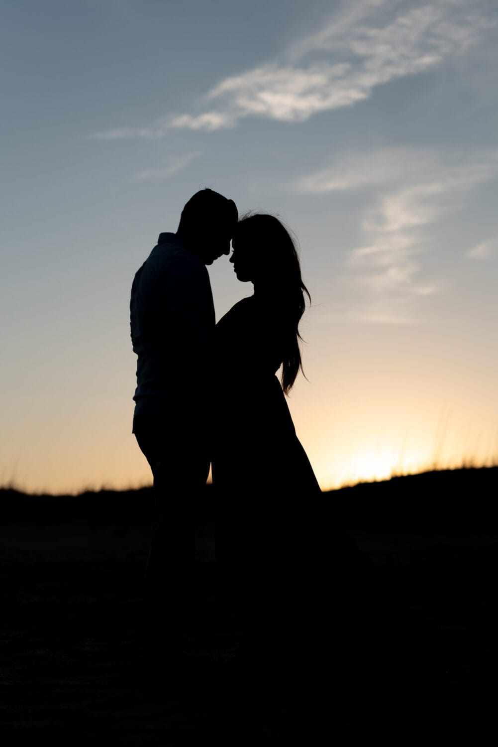 Man and woman silhouette - Huntington Beach State Park