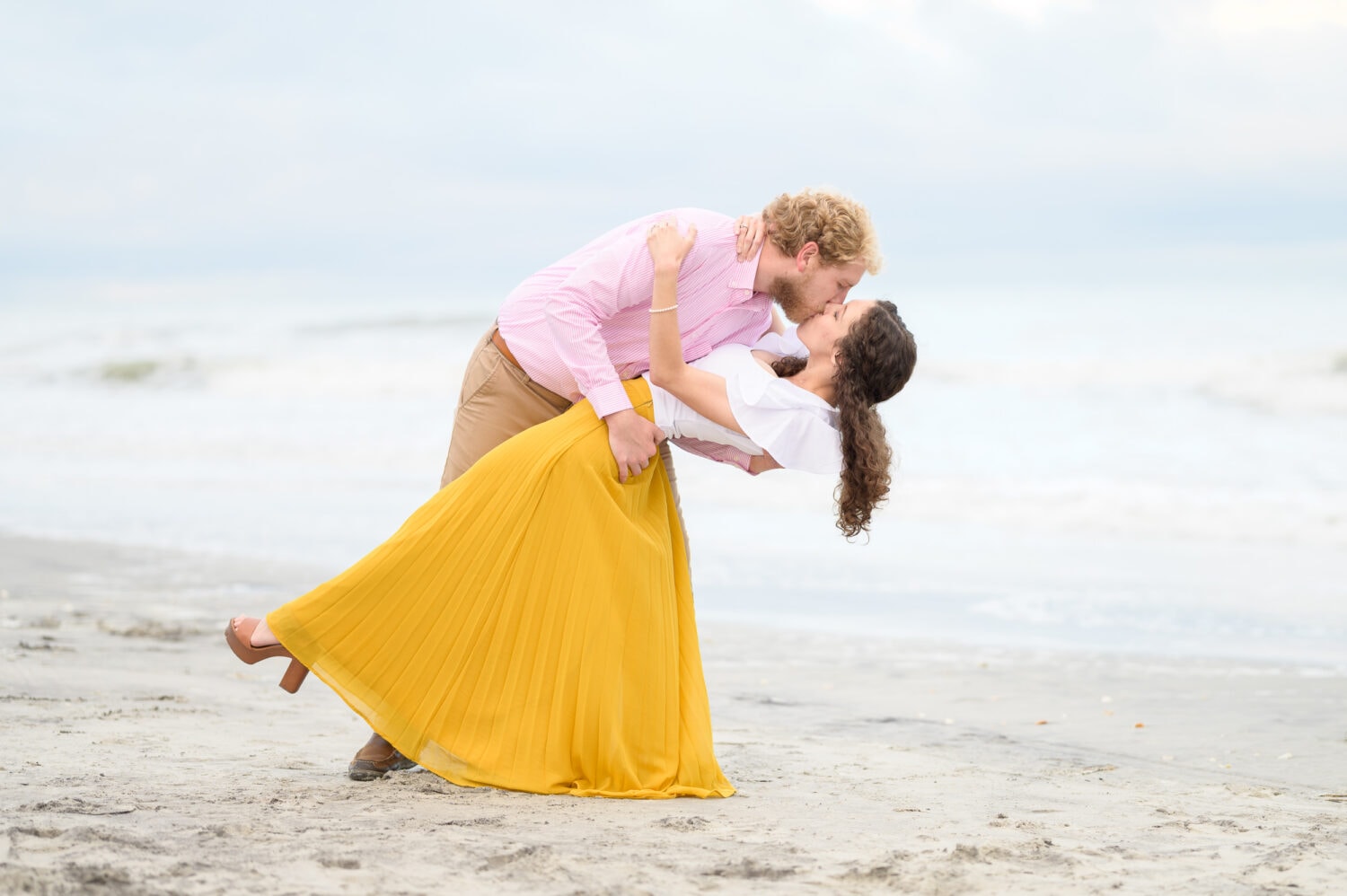 Overcast day for a happy couple on the beach - Huntington Beach State Park