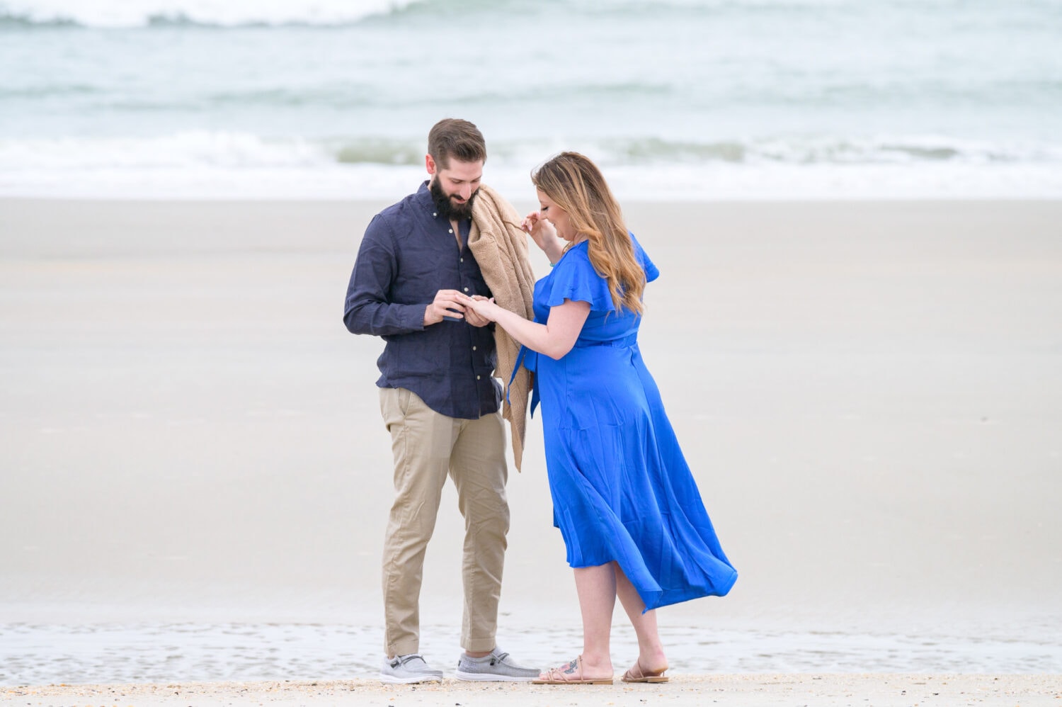 Surprise proposal and engagement pictures on a cloudy day - Huntington Beach State Park