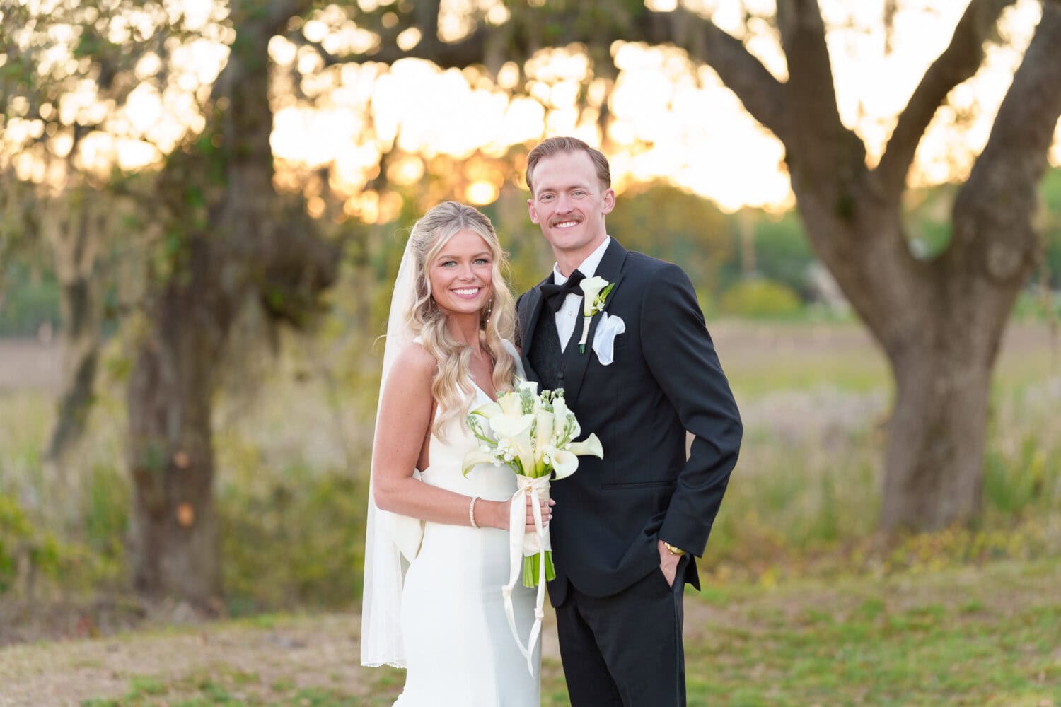Big smiles in front of the sunset - Pawleys Plantation