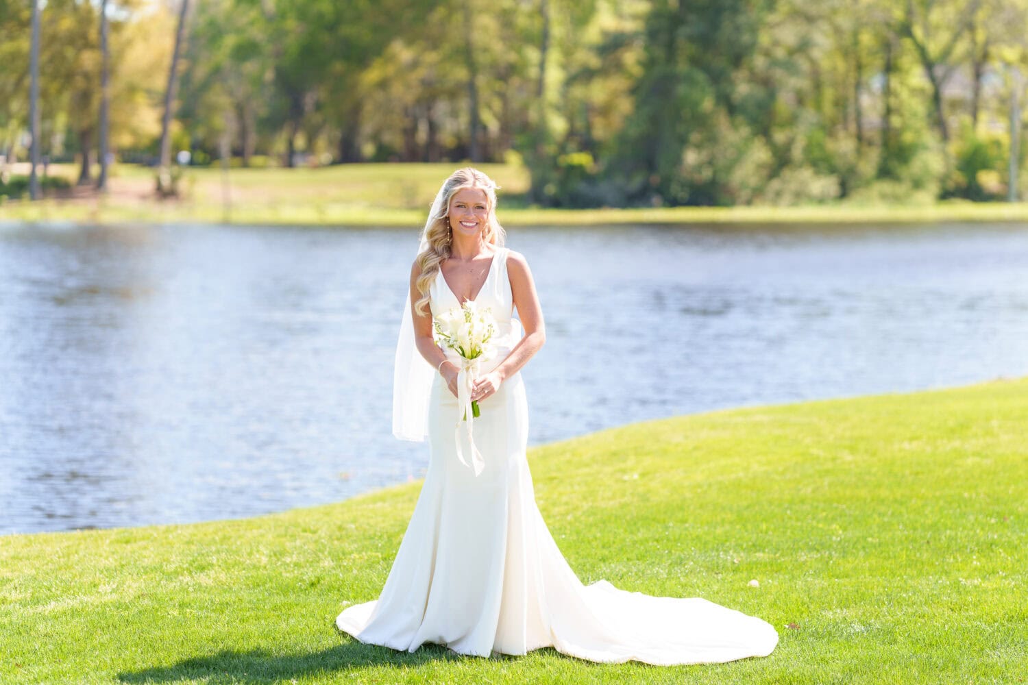 Bride in the sun by the lake - Pawleys Plantation