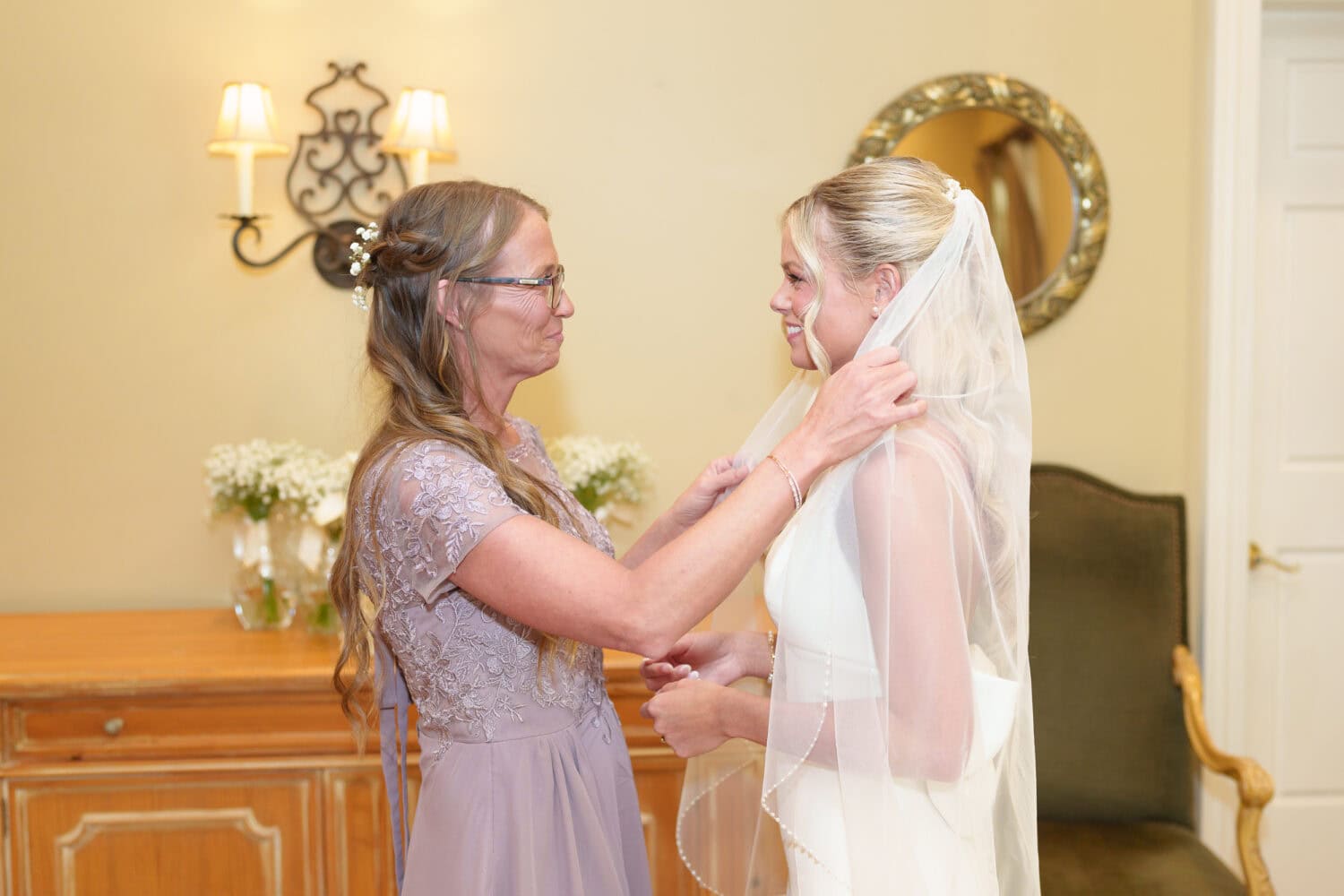 Mother helping bride with her veil - Pawleys Plantation