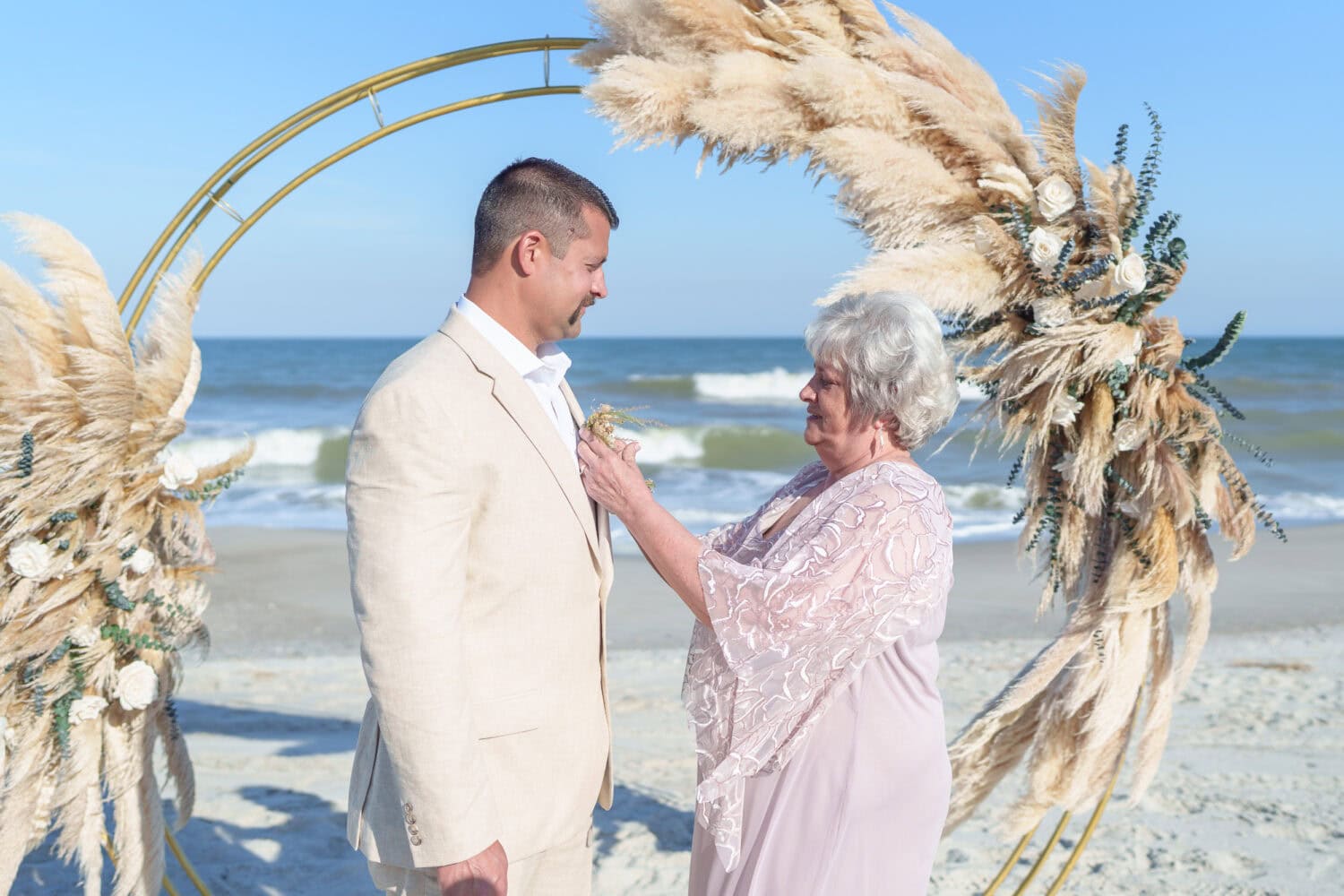 Mom helping groom with boutonniere - Beach House in Pawleys Island