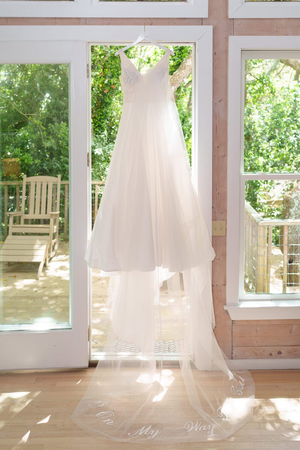 Wedding dress hanging in the doorway - Beach House in Pawleys Island