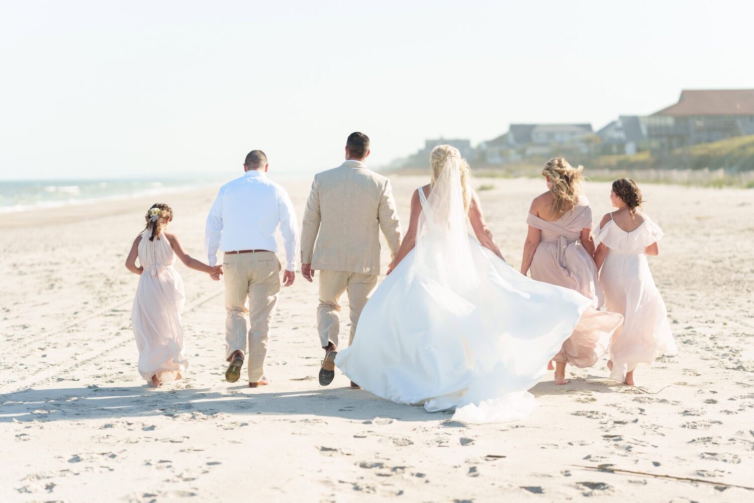Wedding party walking down the beach - Beach House in Pawleys Island