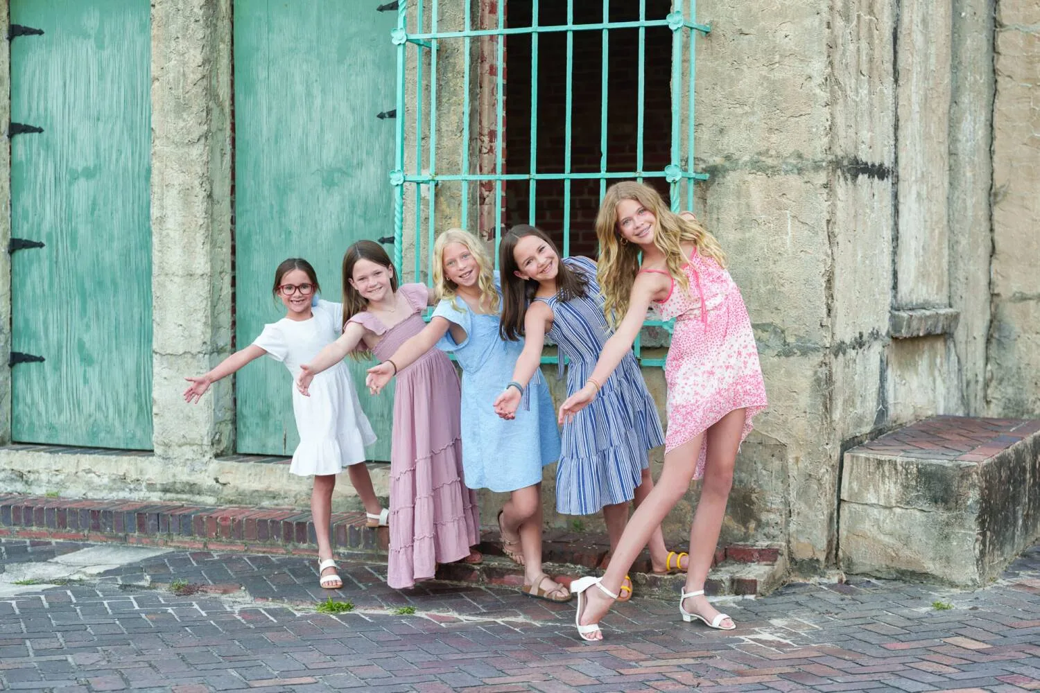 Girls hanging from the castle window - Huntington Beach State Park